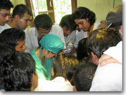 Students crowd round one of Dr Milne's surgery demonstrations